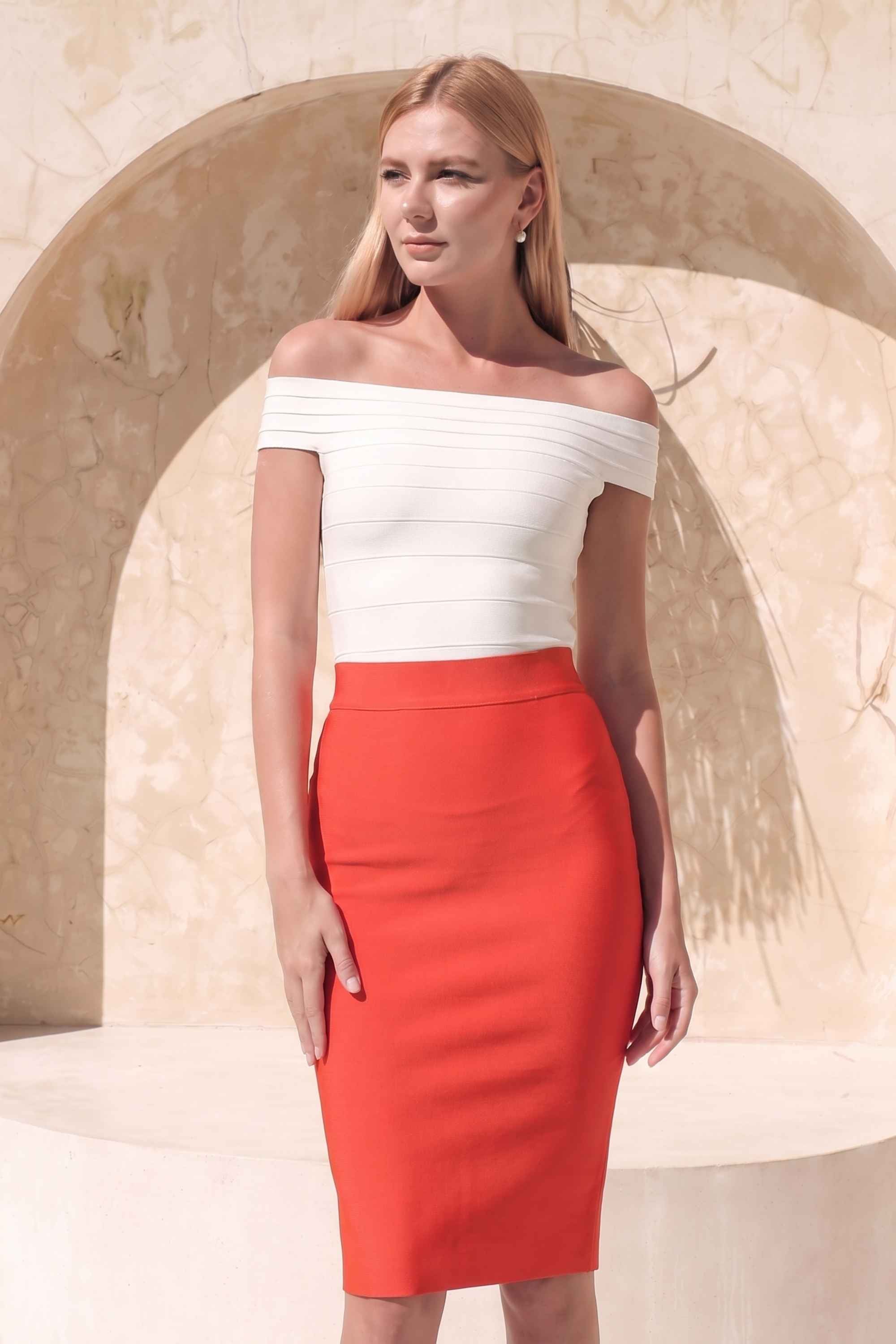 Woman wearing a figure flattering  Pencil High Waist Bandage Knee Length Skirt - Lipstick Red BODYCON COLLECTION