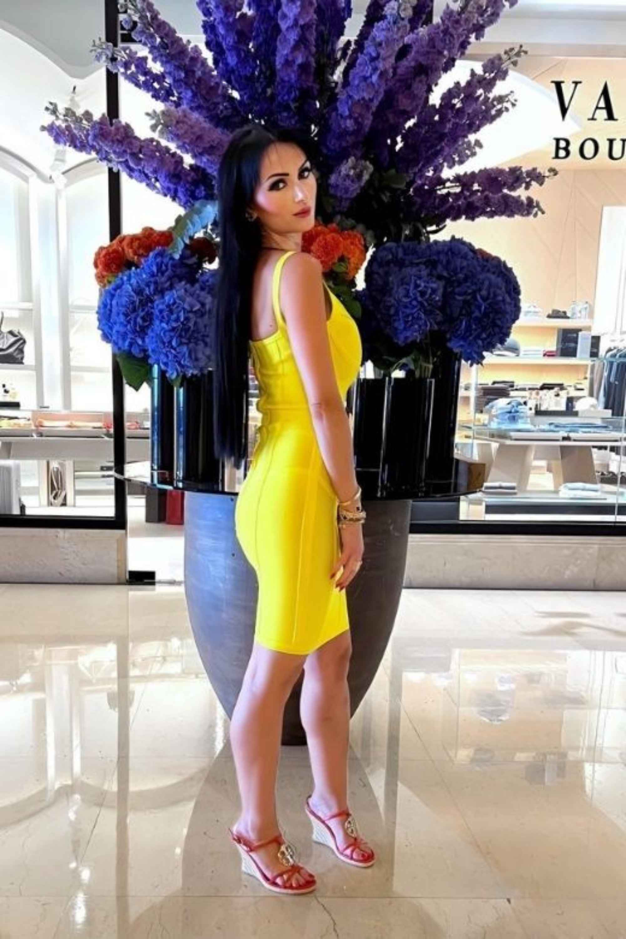 Woman wearing a figure flattering  Pip Bandage Mini Dress - Sun Yellow BODYCON COLLECTION