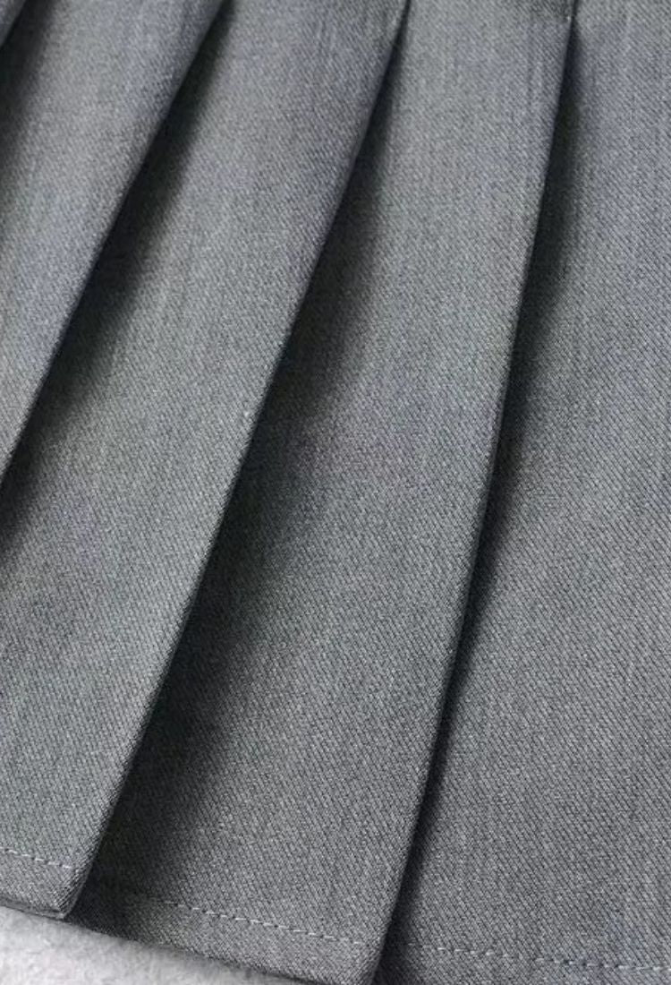 Woman wearing a figure flattering  Pleated Mini Skirt - Grey BODYCON COLLECTION Pty Ltd