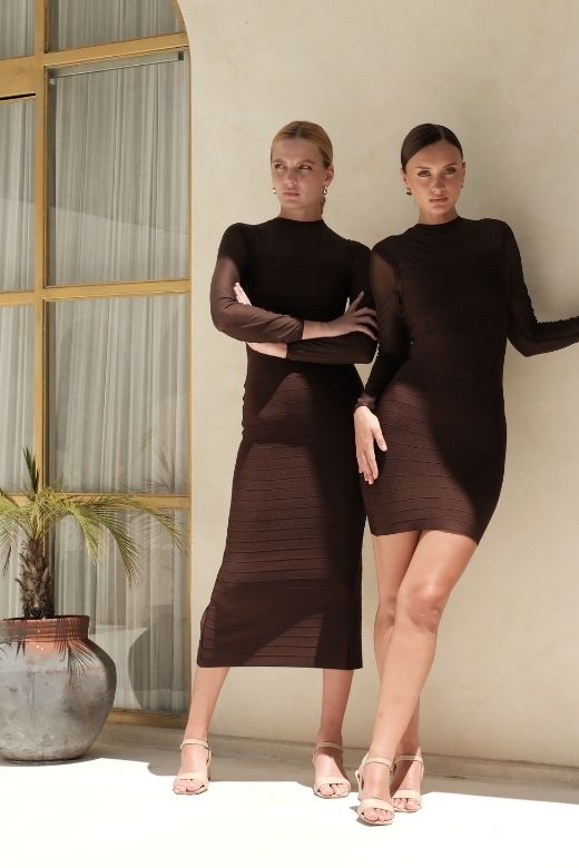 Woman wearing a figure flattering  Robin Long Sleeve Bandage Maxi Dress - White Pearl BODYCON COLLECTION Pty Ltd