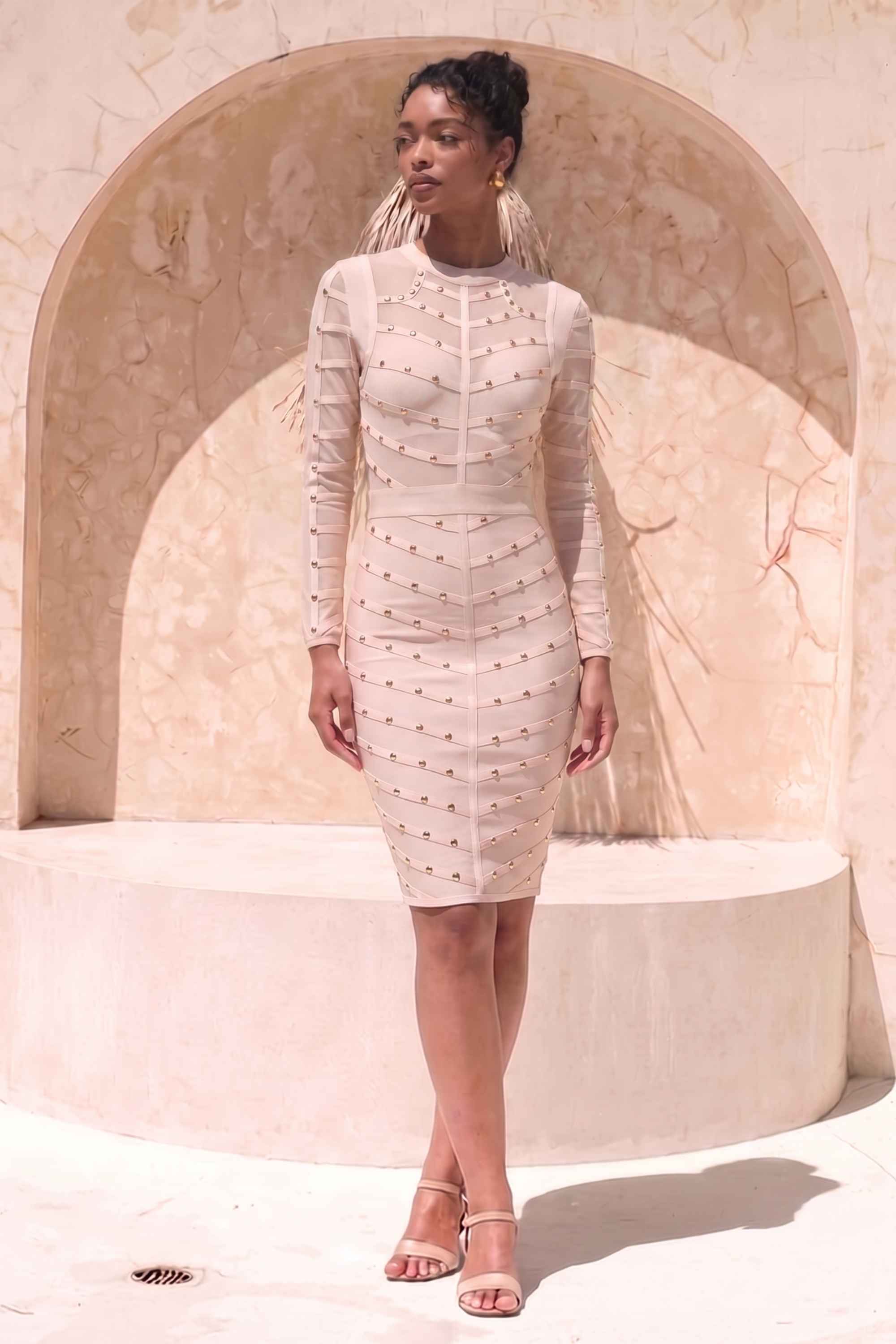Woman wearing a figure flattering  Rosa Long Sleeve Bodycon Dress - Cream BODYCON COLLECTION