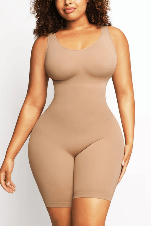 Woman wearing a figure flattering  Round Neck One Piece Bodysuit Shapewear - Mid Thigh Bodycon Collection