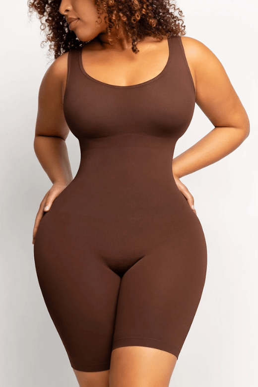 Woman wearing a figure flattering  Round Neck One Piece Bodysuit Shapewear - Mid Thigh Bodycon Collection