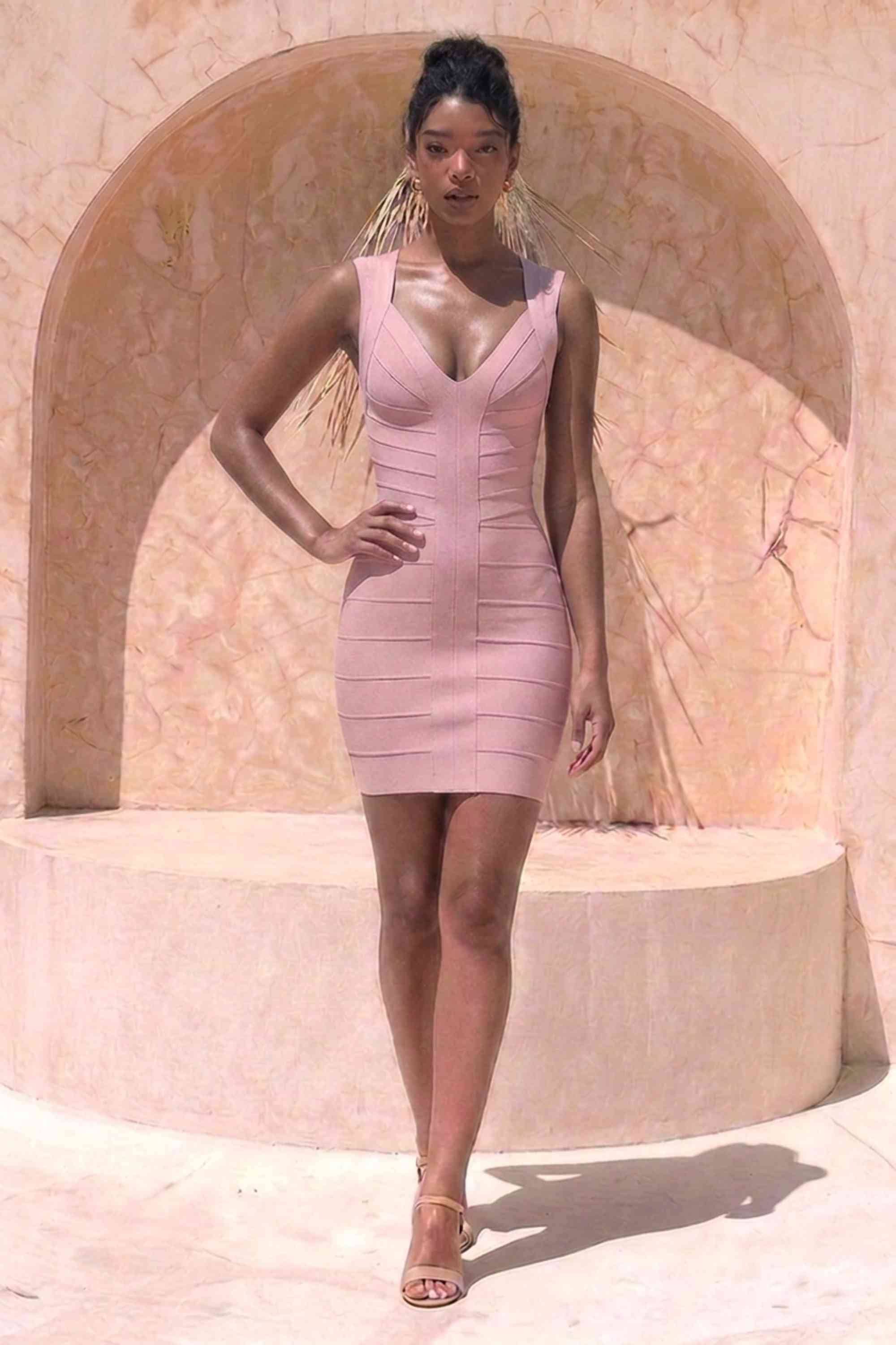 Woman wearing a figure flattering  Sabrina Bandage Mini Dress - Pale Pink BODYCON COLLECTION Pty Ltd