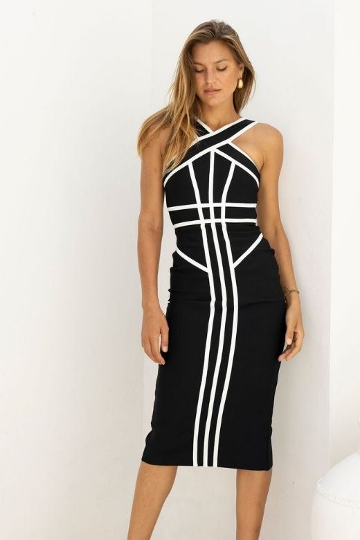 Woman wearing a figure flattering  Suki Bandage Midi Dress - Classic Black BODYCON COLLECTION