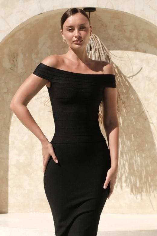 Woman wearing a figure flattering  Vera Bandage Off Shoulder Top - Classic Black BODYCON COLLECTION Pty Ltd